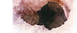 Surface Hole Showing Evidence of Dissolution
